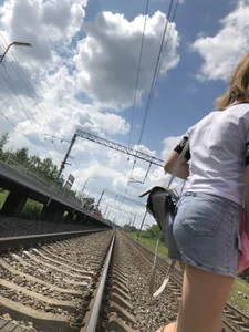 Cute Girl in Denim Shorts Walking Down a Railway Station Gallery