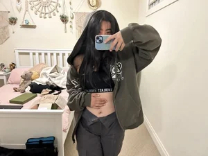Hot Asian teen wears skimpy sports bra under jacket