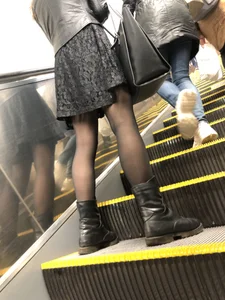 Girl in a Leather Jacket, Skirt, Black Pantyhose and Boots on the Subway Escalator Creepshots - Nice Thin Legs