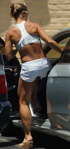 Fit babe in white shorts with big boobs in athletic top