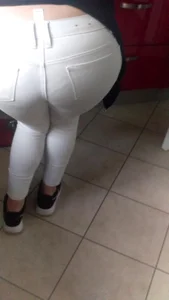 Girl Bending Over in White Tight Jeans Ass Closeup