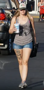 Hot blonde after shopping in short jean shorts and tank top