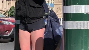 Hottie in spandex booty shorts with a nice ass showing her cheeks and slight camel toe