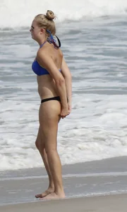 Florida blonde in blue and black bikini on the beach