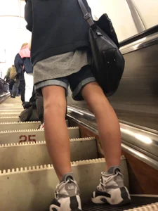 Girl in Boyish Clothes with Skinny Legs Subway Escalator Candid