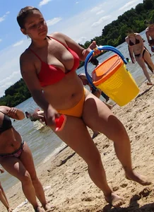 Thick girl with tattoos, big tits and a big booty in a little bikini