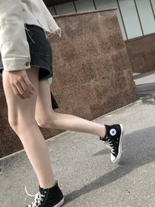 Cute candid teen with pale slim legs in shorts