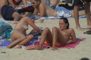 Topless girls on a beach in Barcelona