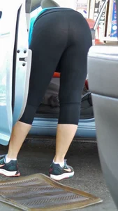 Girl in tight see through leggings with nice ass cleaning her car