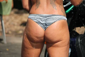Thick sexy cutie washing motorcycles in sexy thong bikini with big booty