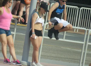 Couple of babes standing around in shorts