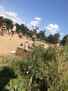 Hot Girl in a Swimsuit Lying on a Bench at the Beach Creepshots