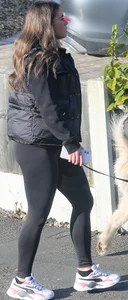 Pouting brunette teen in black leggings