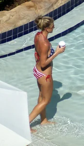 Blonde babe at the pool with sexy body in USA bikini