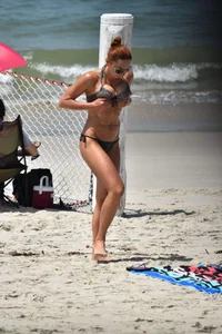 Redhead with nice tits in a bikini on the beach