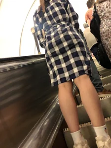 Fit Legs in White Socks and Sneakers on an Escalator Photos