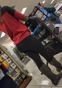 Brunette with a tight butt, boots, and a VPL