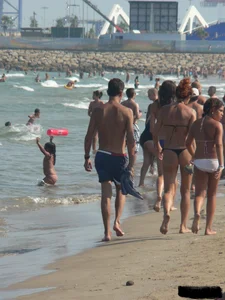 Bunch of sexy babes at the beach in thong bikinis
