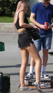 Tall blonde and pink haired girl showing her ass cheeks