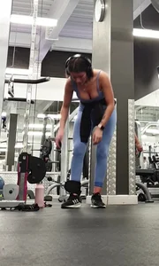 Bending gym babe stern face
