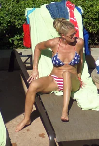 Blonde babe at the pool with sexy body in USA bikini