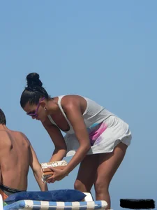 Hot ass topless beach girl with great tits lets her little brother oil up her ass in thong bikini