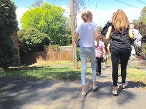 Very skinny candid blonde teen wearing tight jeans walking down the countryside road