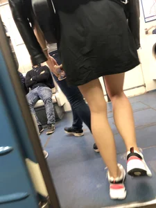 Blonde in a Dress and Sneakers With Sexy Skinny Legs in the Subway Train and on the Escalator Closeup Candid Photos