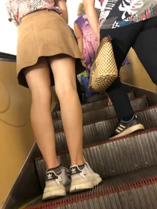 Amazing Hot Girl in a Skirt and Sneakers Sitting Cross-Legged in the Subway Train and on the Escalator Candid Photos Gallery