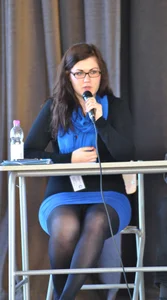 Strict Candid Girl Wearing Glasses, a Blue Skirt And Black Pantyhose Giving a Speech Creepshot