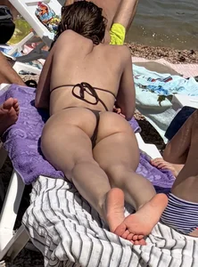 Large collection of hot beach girls lying on the beach and bending over