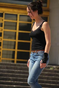 Hot brunette skateboarder in tight jeans and with hard nipples