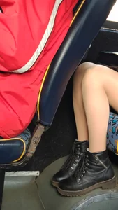 Legs in Pantyhose in the Bus Closeup