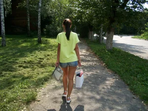 Girl in Denim Mini Shorts Walking Down the Suburb Street Candid