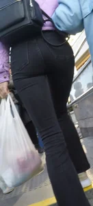 Juicy ass in black tight jeans and nice skinny legs street closeups