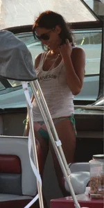 Bikini babe on a boat with a wet see through white shirt showing her tits