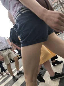 Young Girl in Shorts And Sandals Crossing the Street Gallery