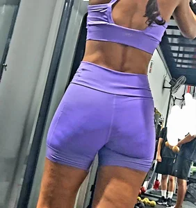 Girl in lilac short leggings at the gym