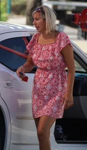 Sexy blonde upskirted in pink dress while cleaning her car