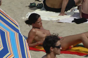 Topless girls on a beach in Barcelona