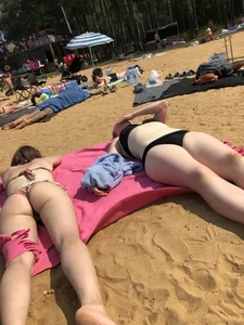 Hot Girls in Swimsuits Lying on a Beach Gallery