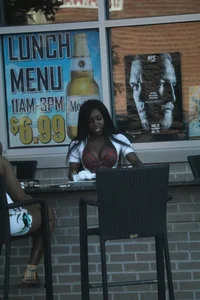 Sexy ebony Tilted Kilt employee in her uniform
