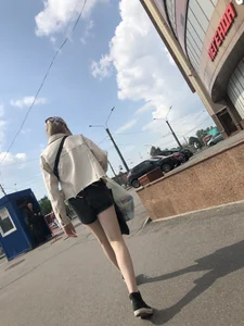 Cute candid teen with pale slim legs in shorts