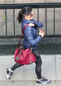 Brunette lady in leggings out walking