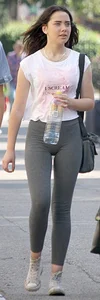 Brunette girl in grey leggings showing her mound, slight camel toe and gap