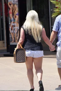 Thick blonde with big boobs in short white shorts