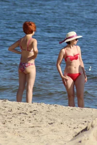 Couple of hot babes hanging out at the beach in bikinis