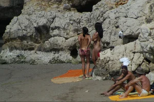 Girls on a nude beach in Sitges, Spain