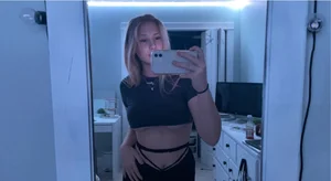 Hot Girl in a Top With Her Boobs Partly Sticking Out Mirror Selfie