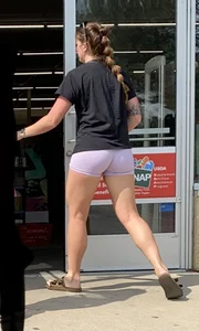 in purple Lycra shorts…